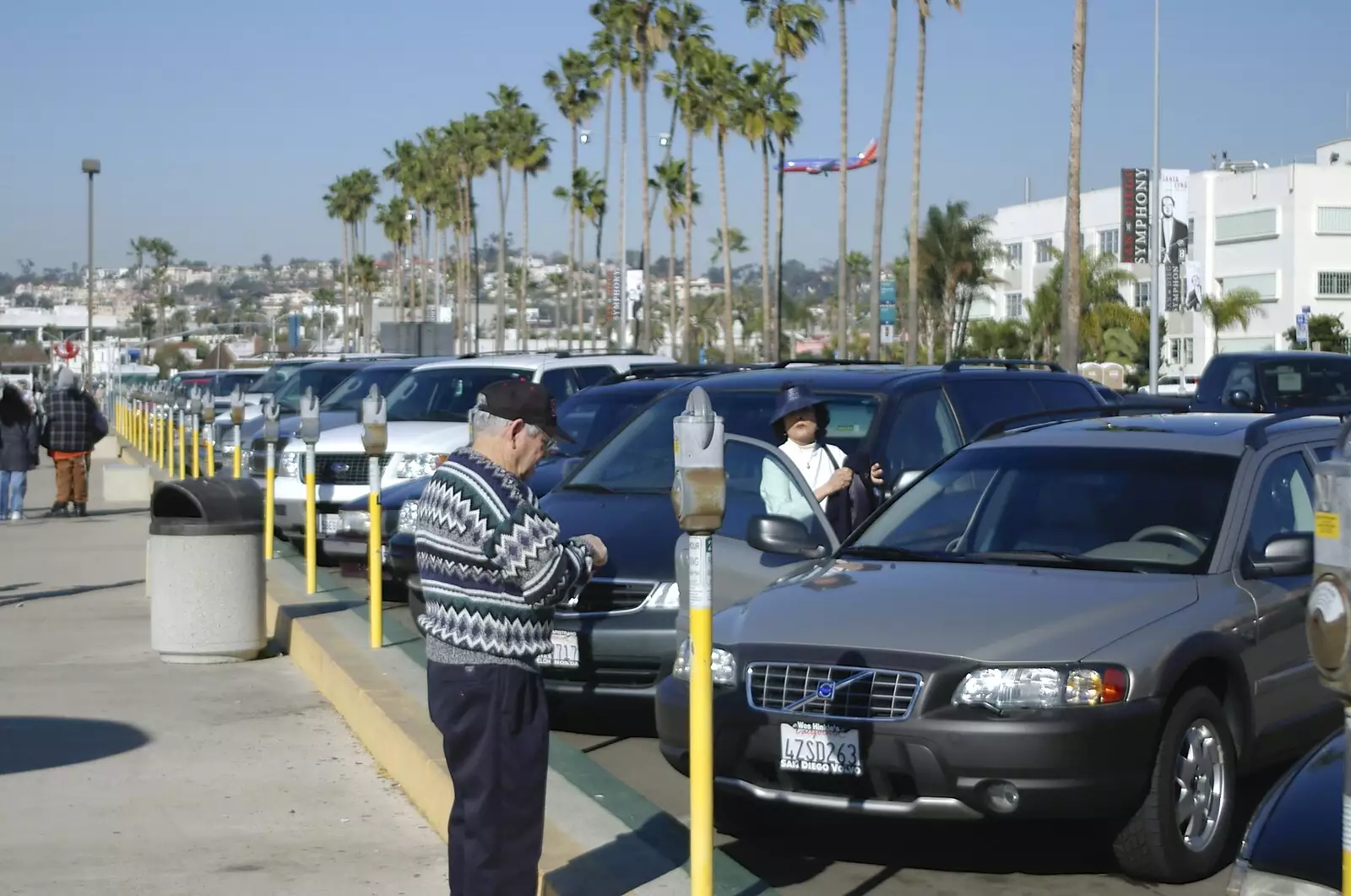 Paying for parking, as a plane comes in to land, from A Trip to San Diego, California, USA - 11th January 2005