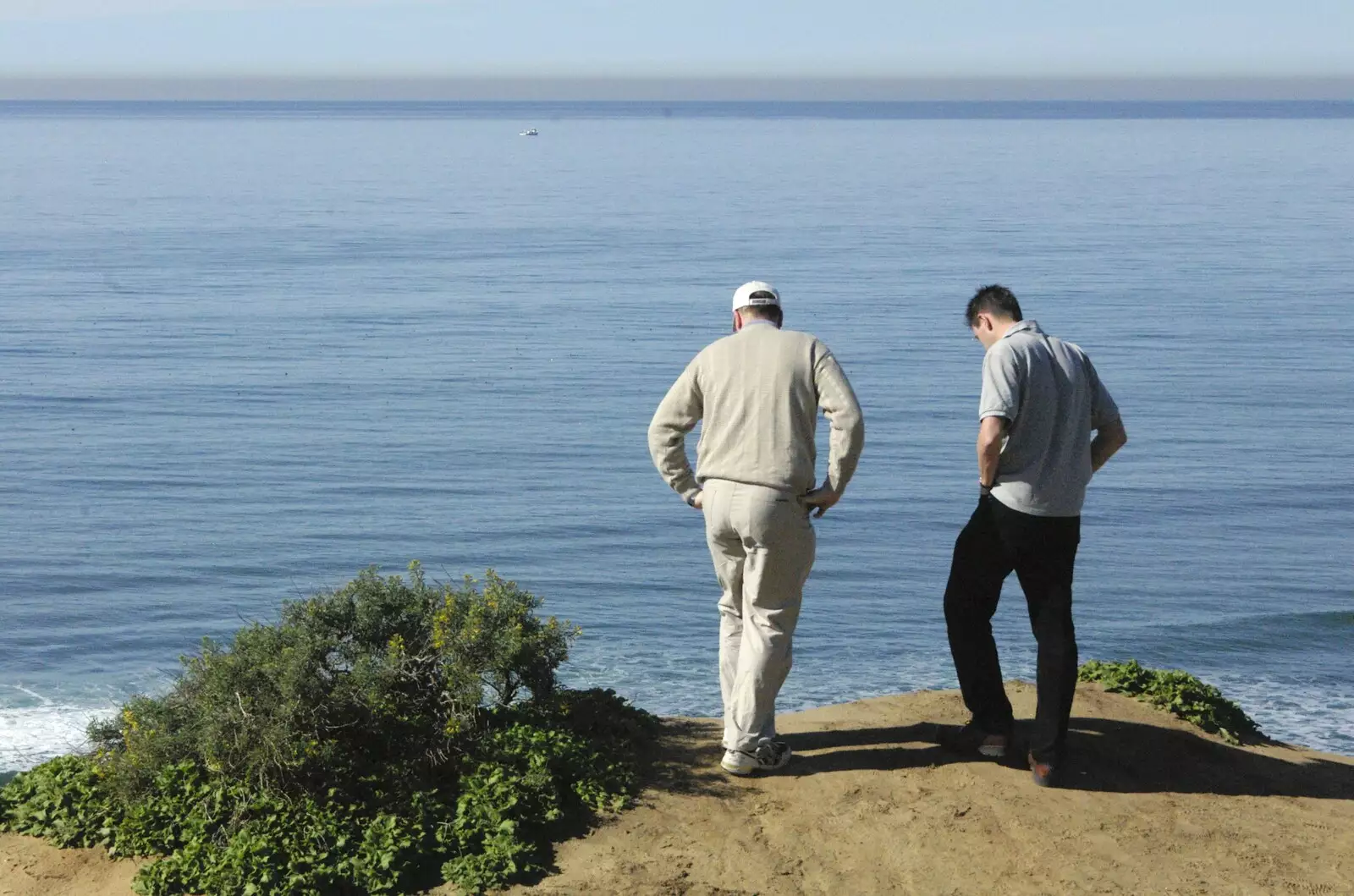 Rusty and John look over the cliff, from A Trip to San Diego, California, USA - 11th January 2005