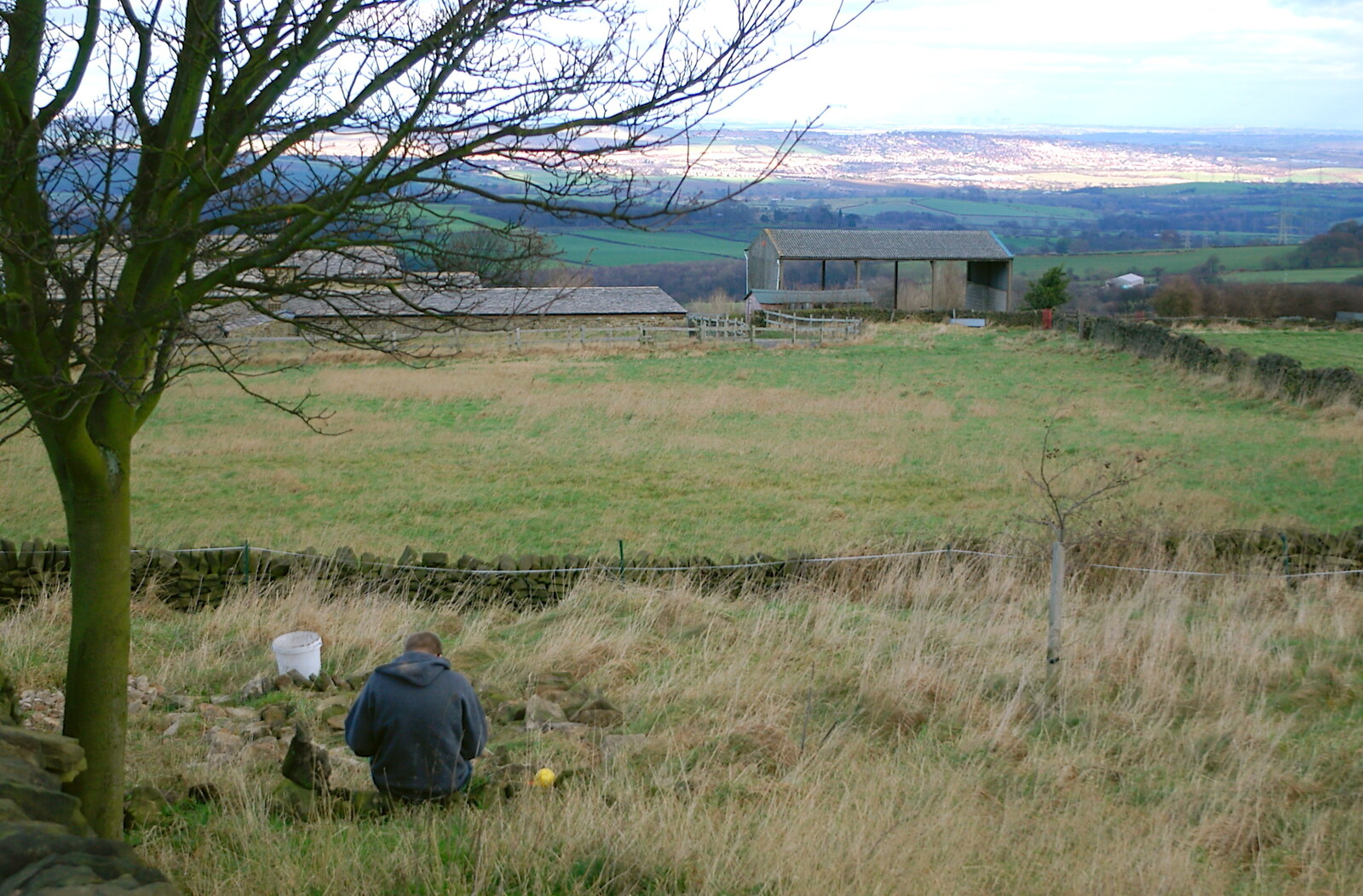 Driving Around Oop North, Hoylandswain, West Yorkshire - 30th January 2005: A young lad does dry-stone walling