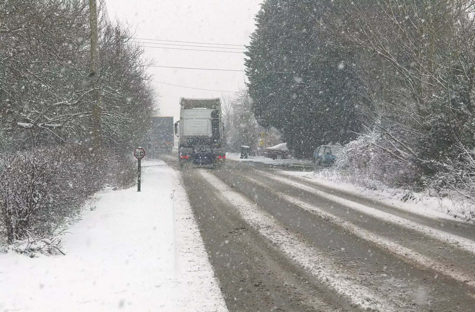 A heavy tractor unit negotiates the snow, from Wendy Leaves "The Lab" and a Snow Day, Cambridge and Brome - 25th February 2005