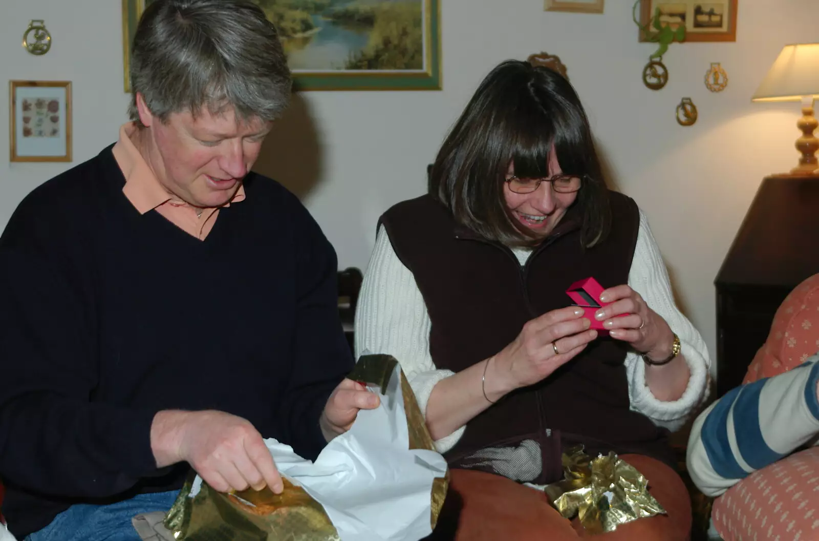 Neil and Caroline open late Christmas presents, from Mike's 70th Birthday, Christchurch, Dorset - 12th March 2005