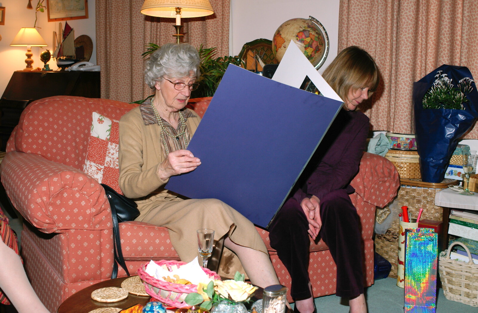 Grandmother looks at an oversized card from Mike's 70th Birthday, Christchurch, Dorset - 12th March 2005
