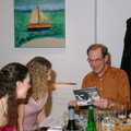 2005 Mike reads out his gift of a rally day to daughters Hayley and Kim