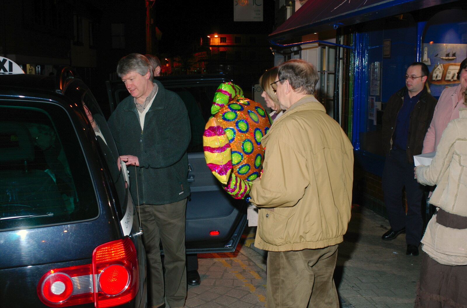 Mike carries his balloon to the taxi from Mike's 70th Birthday, Christchurch, Dorset - 12th March 2005