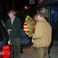 Mike carries his balloon to the taxi, Mike's 70th Birthday, Christchurch, Dorset - 12th March 2005