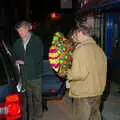 Mike carries his balloon to the taxi, Mike's 70th Birthday, Christchurch, Dorset - 12th March 2005