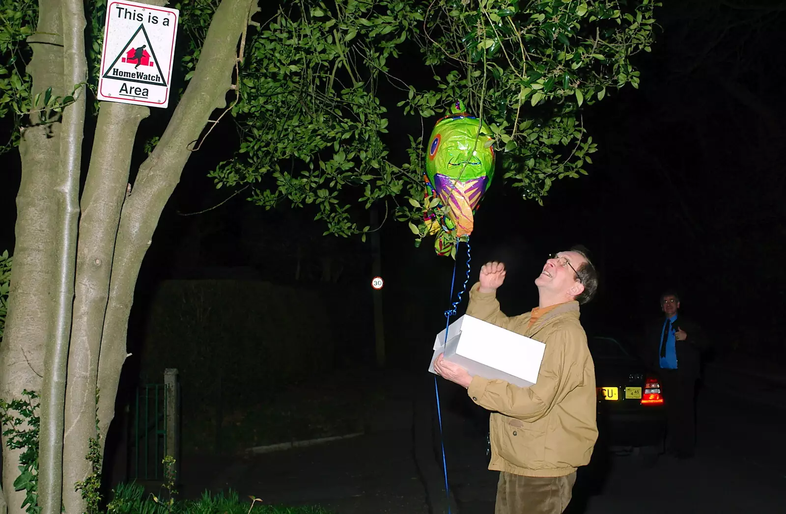 Mike gets his helium-filled fish stuck up a tree, from Mike's 70th Birthday, Christchurch, Dorset - 12th March 2005