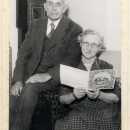 Elsie's parents' Golden Wedding in 1946. They are holding a telegram from the Queen