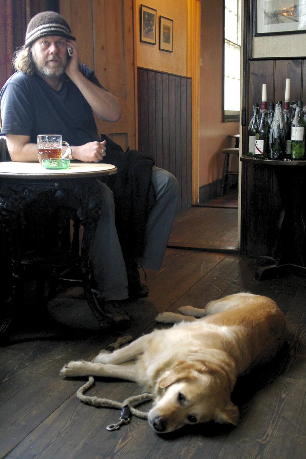 A pub dog dozes on the floor of the Station Hotel from The BSCC Easter Bike Ride, Framlingham, Suffolk - 26th March 2005