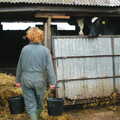 Wavy carries some buckets to the sheds, Wavy and the Milking Room, Dairy Farm, Thrandeston, Suffolk - 28th March 2005