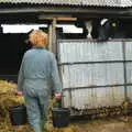 Wavy carries some buckets to the sheds, Wavy and the Milking Room, Dairy Farm, Thrandeston, Suffolk - 28th March 2005