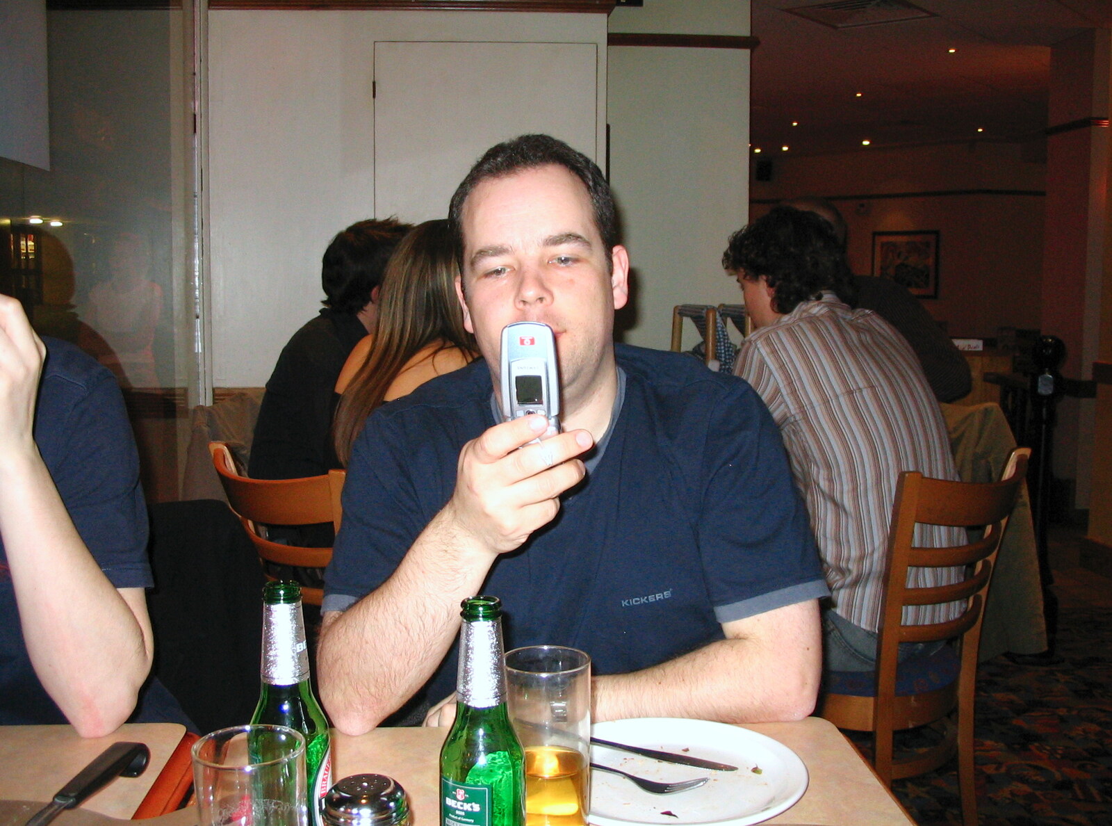 Russell checks his phone out in Pizza Hut, Ipswich from The SCC Social Club and the  Demolition of Diss Publishing, Ipswich and Diss - 2nd April 2005