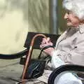 An old woman sits on a bench by the Tourist office, Norwich Market, the BSCC at Occold, and Diss Publishing - 10th April 2005