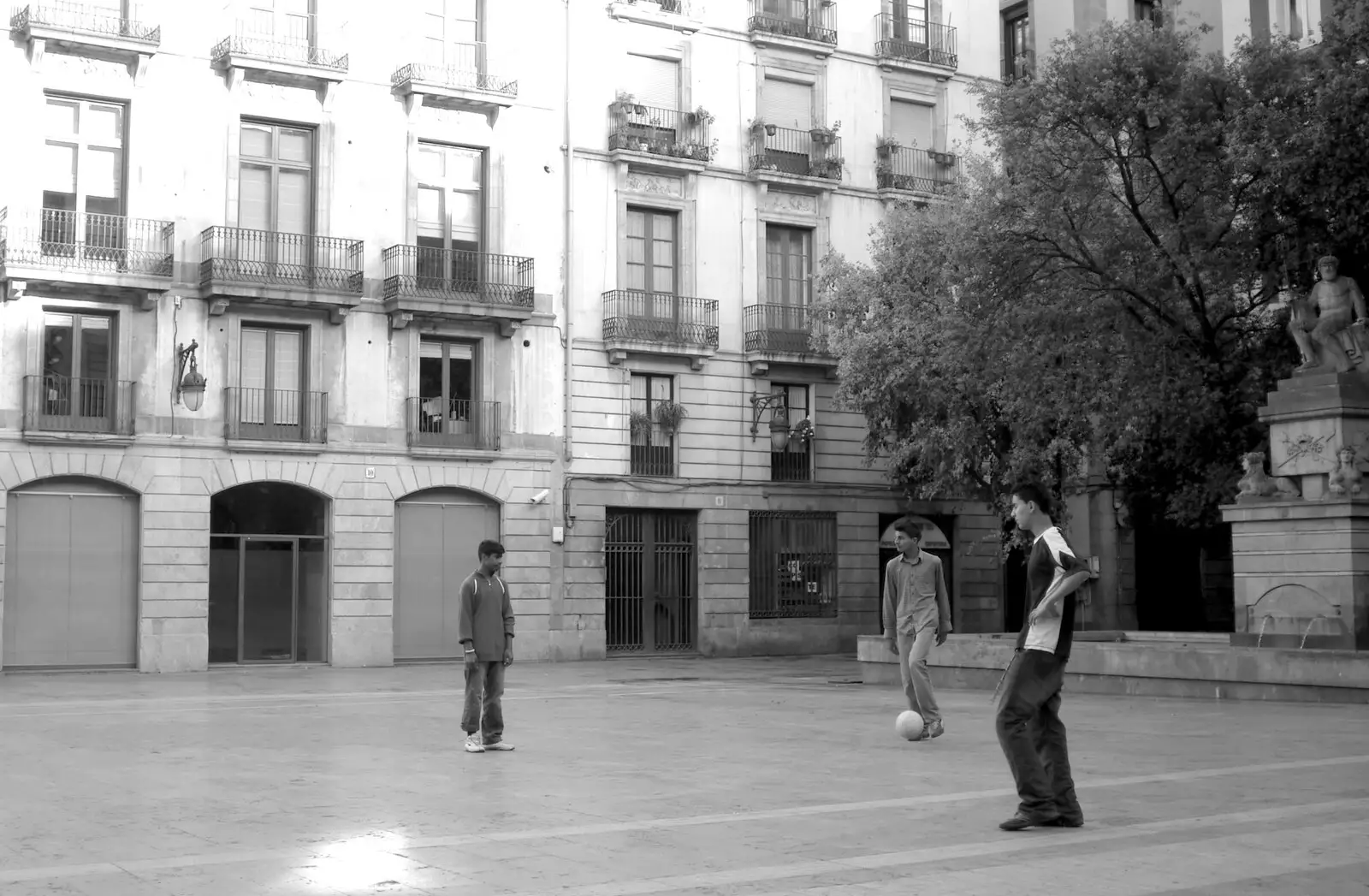 In a quiet side square, some boys play football, from Montjuïc and Sant Feliu de Guíxols, Barcelona, Catalunya - 30th April 2005