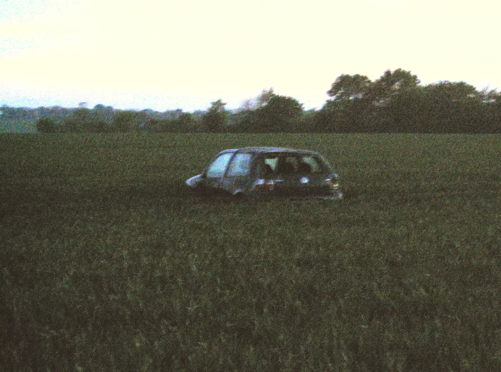 There's a VW Golf in a field of wheat, from BSCC Bike Rides and Fun With Diffraction Gratings, Gissing and Diss - 26th May 2005