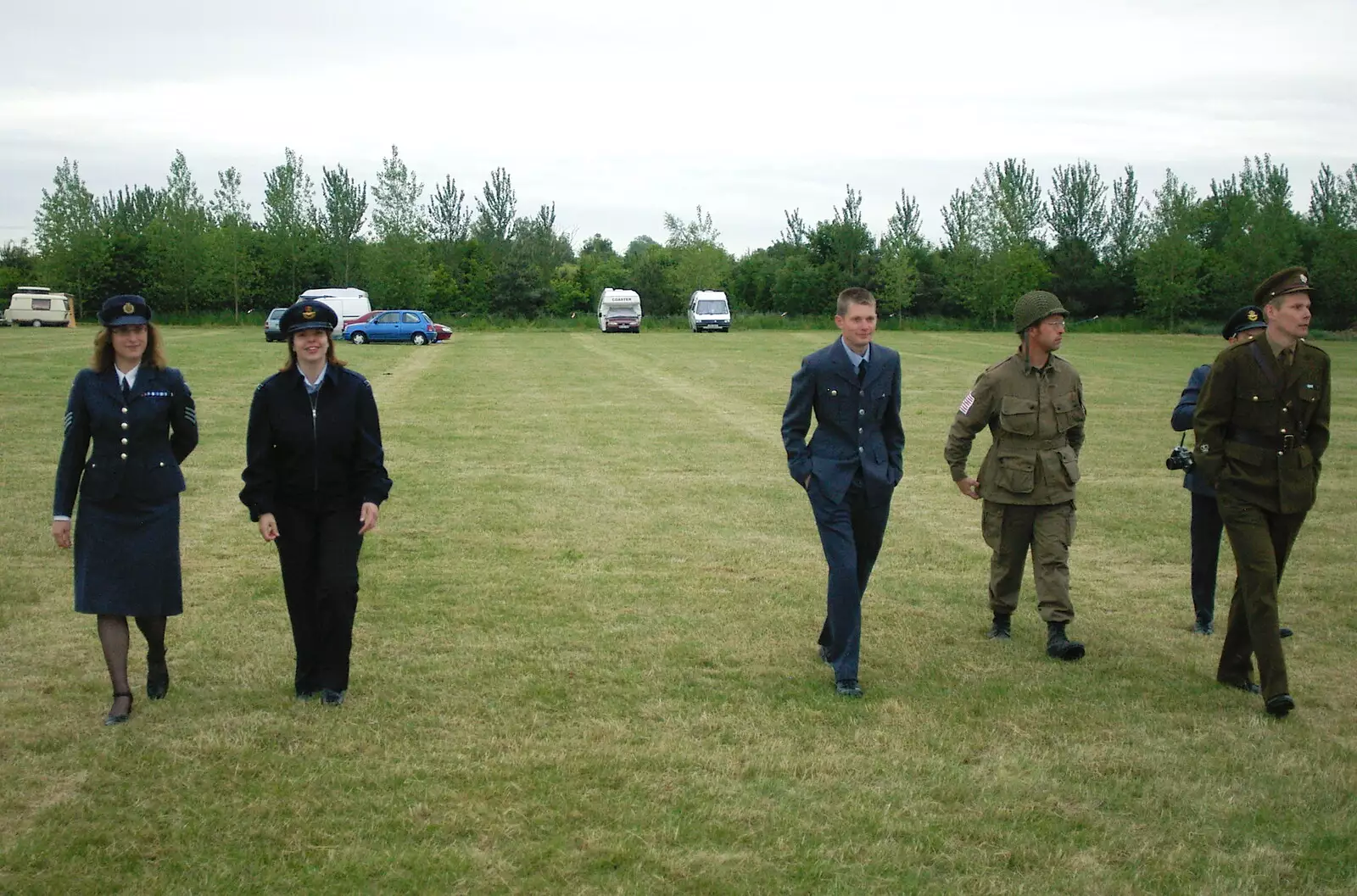 The gang walk to the hangars, from A 1940s VE Dance At Debach Airfield, Debach, Suffolk - 11th June 2005