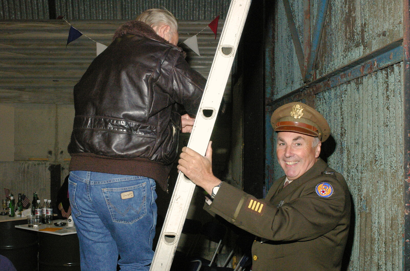 A ladder is held up by Richard, the co-owner from A 1940s VE Dance At Debach Airfield, Debach, Suffolk - 11th June 2005