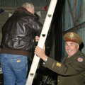 A ladder is held up by Richard, the co-owner, A 1940s VE Dance At Debach Airfield, Debach, Suffolk - 11th June 2005