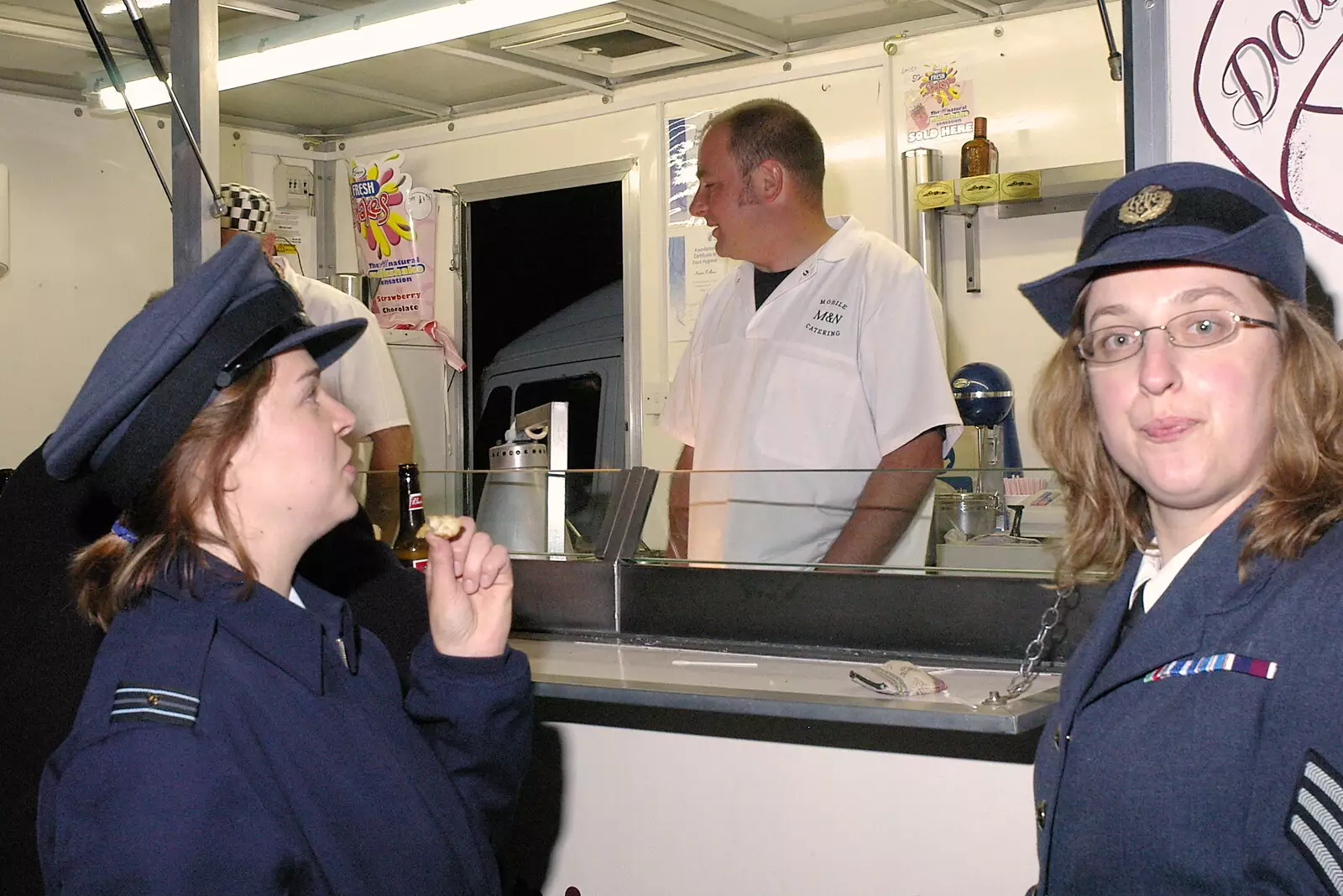 Jen and Sue scrounge some spare pancakes, from A 1940s VE Dance At Debach Airfield, Debach, Suffolk - 11th June 2005