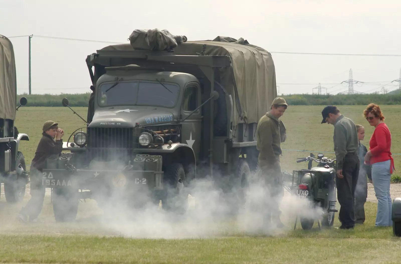 A motorbike churns out some serious pollution, from An Airfield Open Day, Debach, Suffolk - 12th June 2005