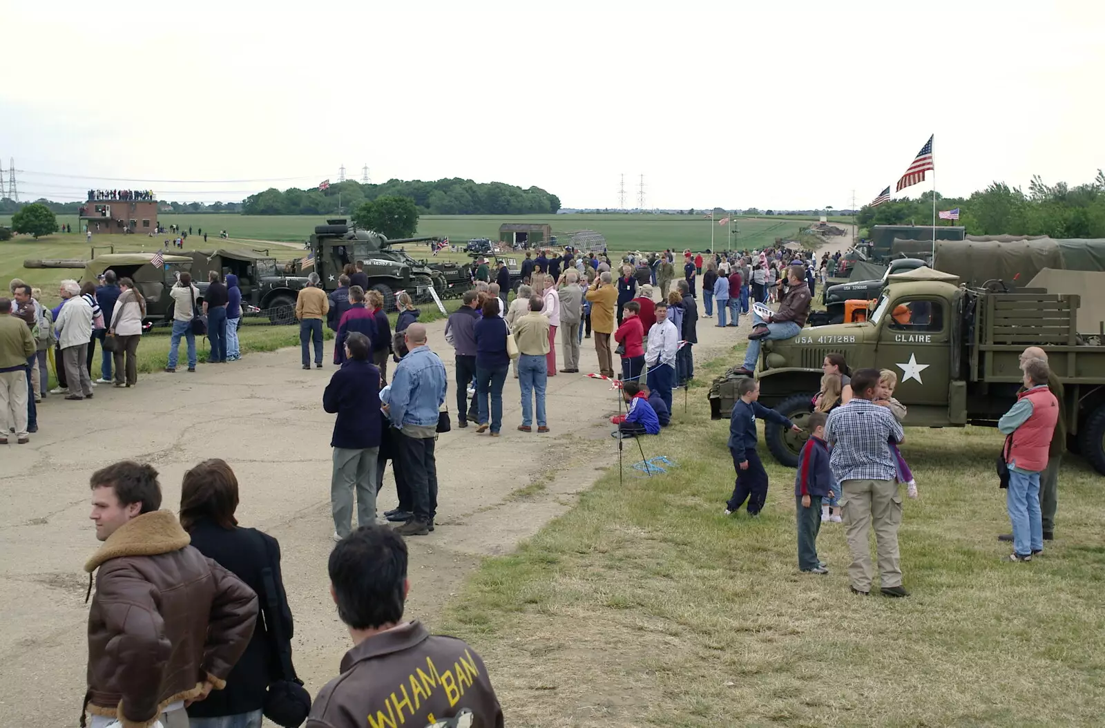 The crowds watch Maurice Hammond's fly-by in Janie, from An Airfield Open Day, Debach, Suffolk - 12th June 2005