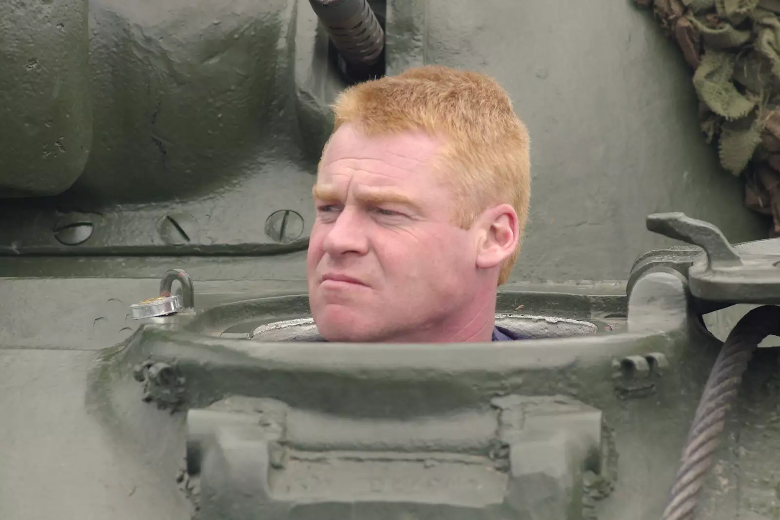 A bloke looks out of a tank, from An Airfield Open Day, Debach, Suffolk - 12th June 2005