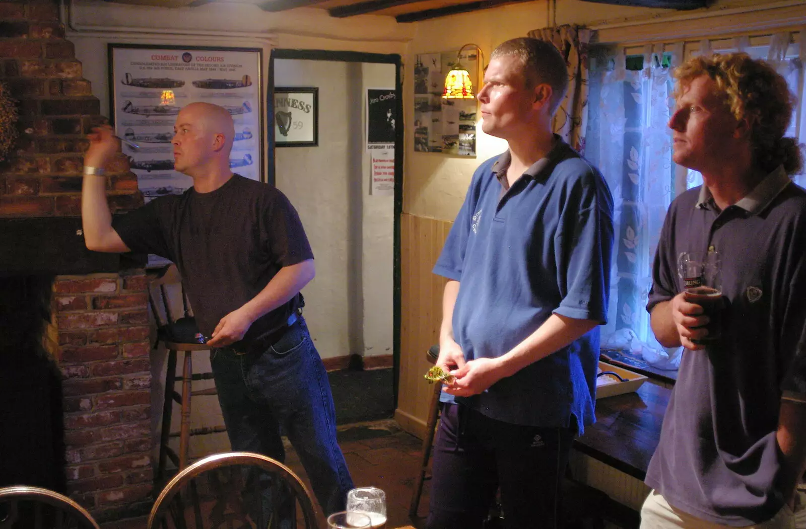 The game is on in the Tibenham Greyhound, from A BSCC Bike Ride and an Indoor Barbeque at the Swan, Tibenham and Brome - 16th June 2005