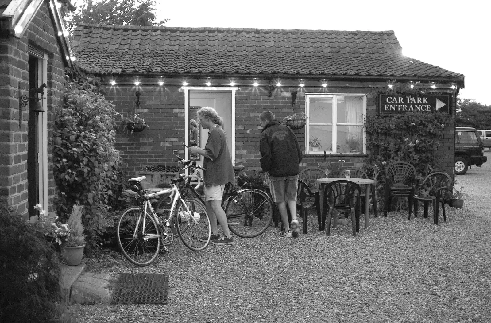 Outside, Wavy and Phil graze on left-over food, from A BSCC Bike Ride and an Indoor Barbeque at the Swan, Tibenham and Brome - 16th June 2005