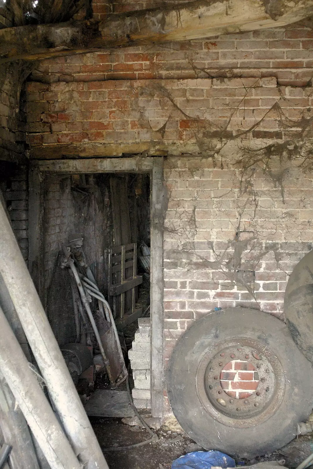 Old tyres and cobwebbed bricks, from A Combine Harvester and the Pig Roast, Thrandeston, Suffolk - 26th June 2005