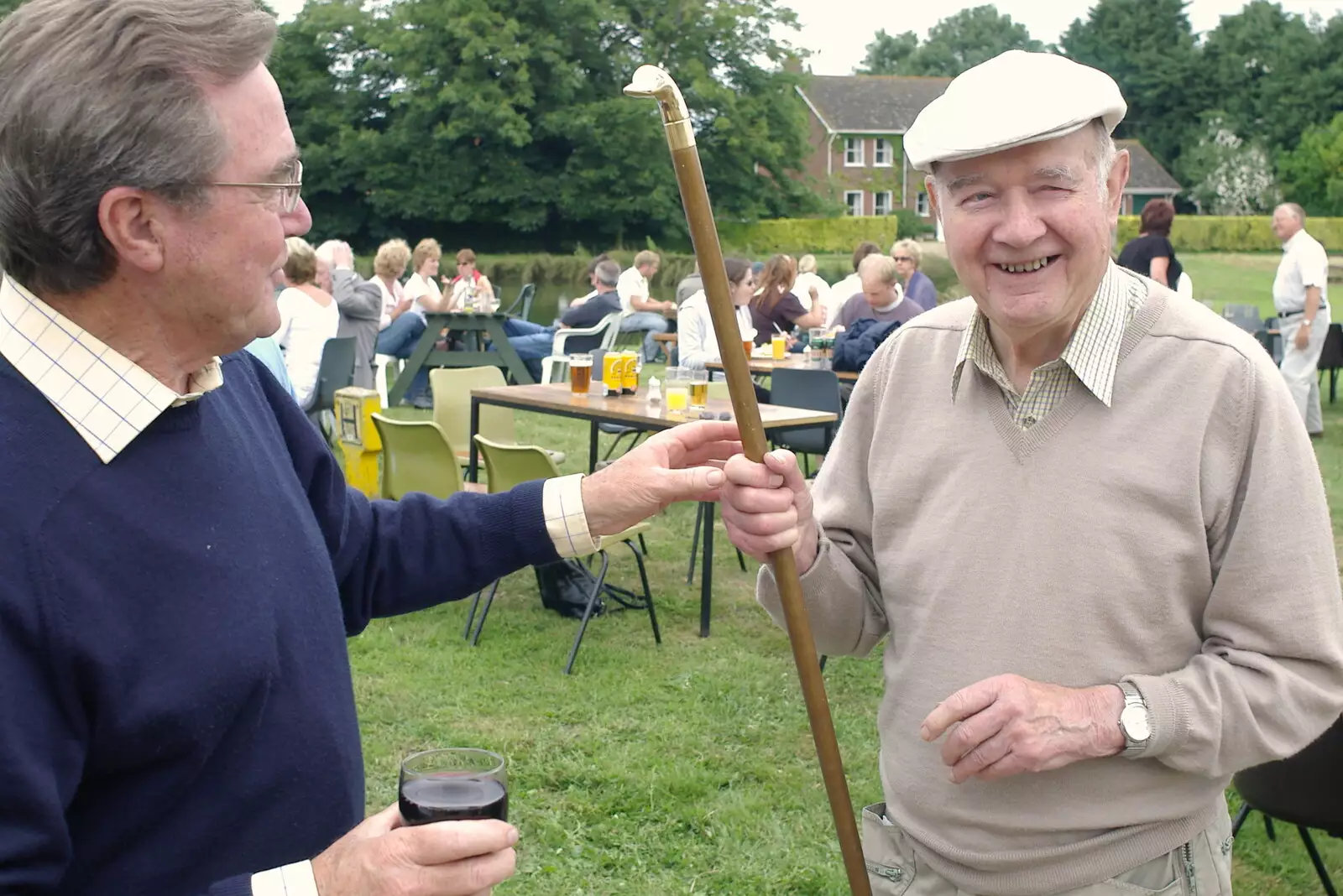 Peter inspects an impressive walking stick, from A Combine Harvester and the Pig Roast, Thrandeston, Suffolk - 26th June 2005