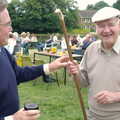 Peter inspects an impressive walking stick, A Combine Harvester and the Pig Roast, Thrandeston, Suffolk - 26th June 2005