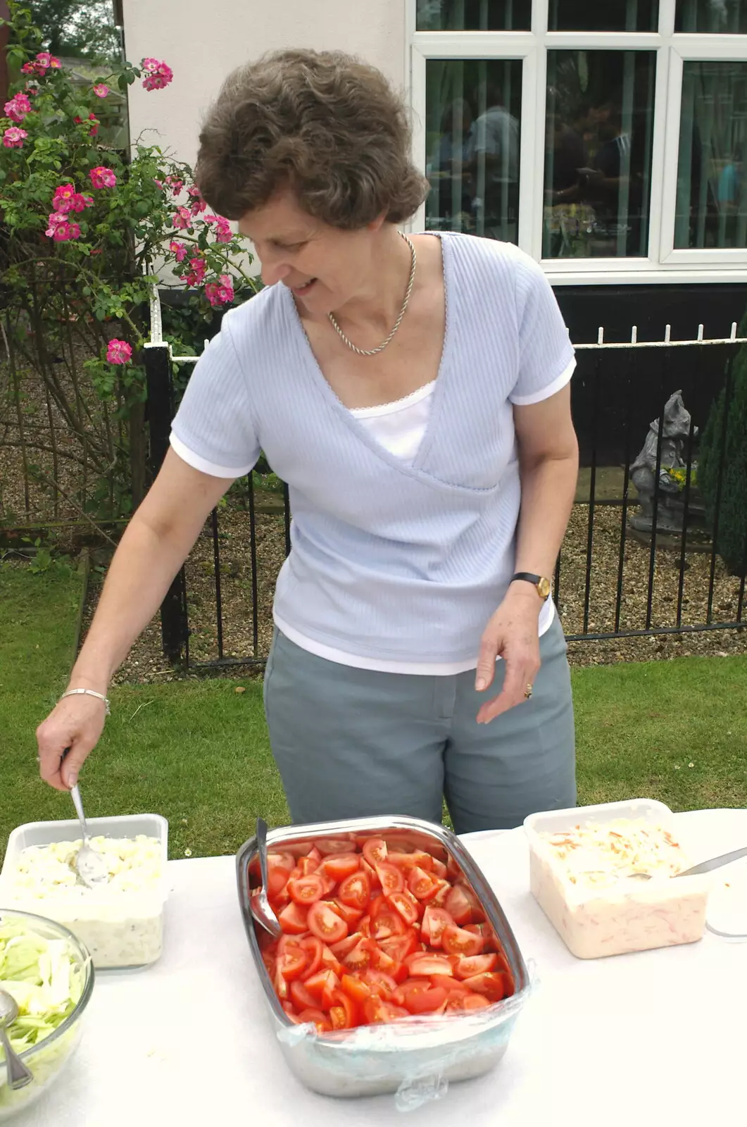 Phil's mum serves up some salad, from A Combine Harvester and the Pig Roast, Thrandeston, Suffolk - 26th June 2005