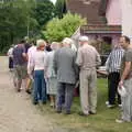 DH waits with a plate, A Combine Harvester and the Pig Roast, Thrandeston, Suffolk - 26th June 2005