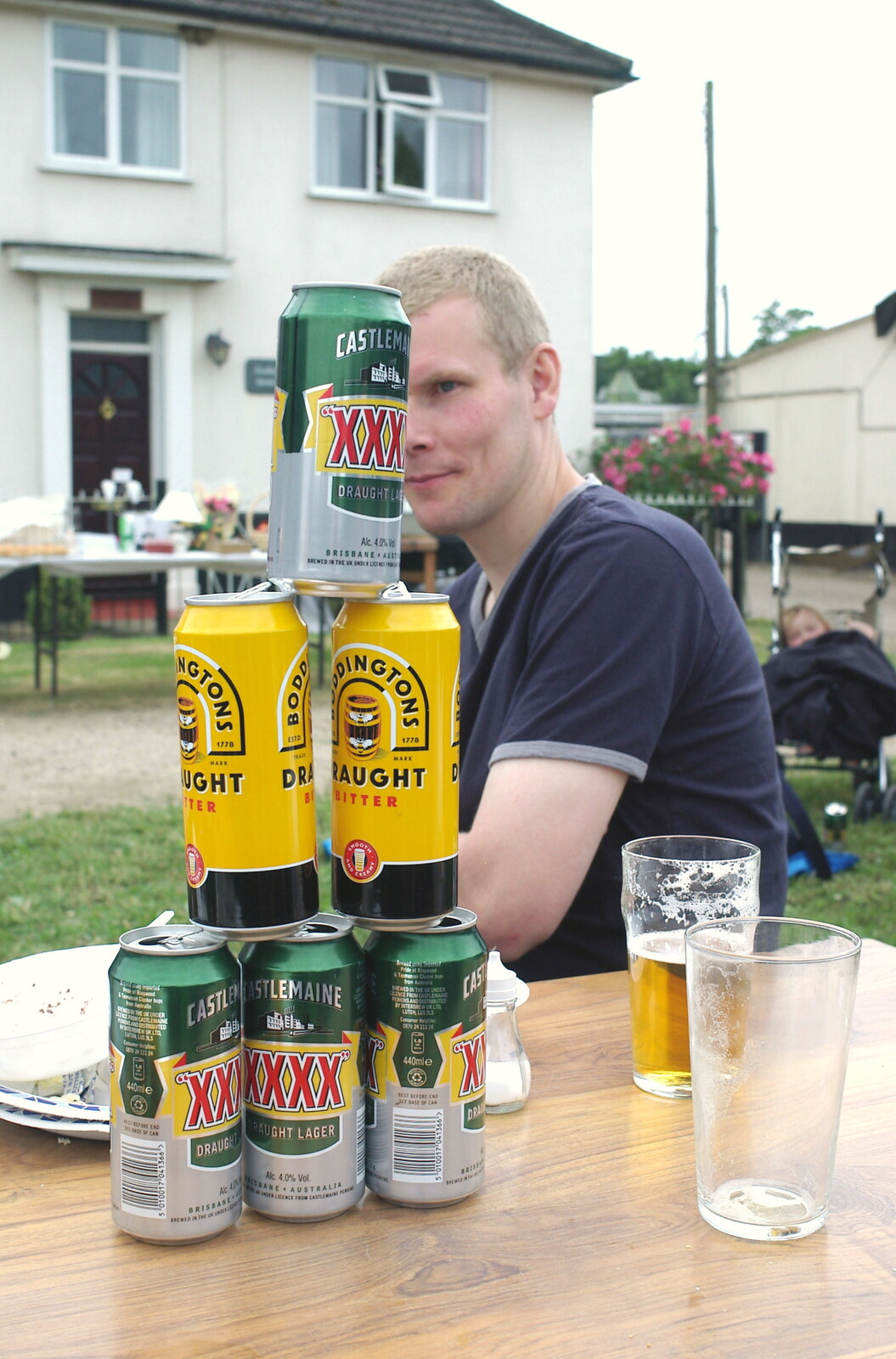 Bill and a stack of cans from A Combine Harvester and the Pig Roast, Thrandeston, Suffolk - 26th June 2005