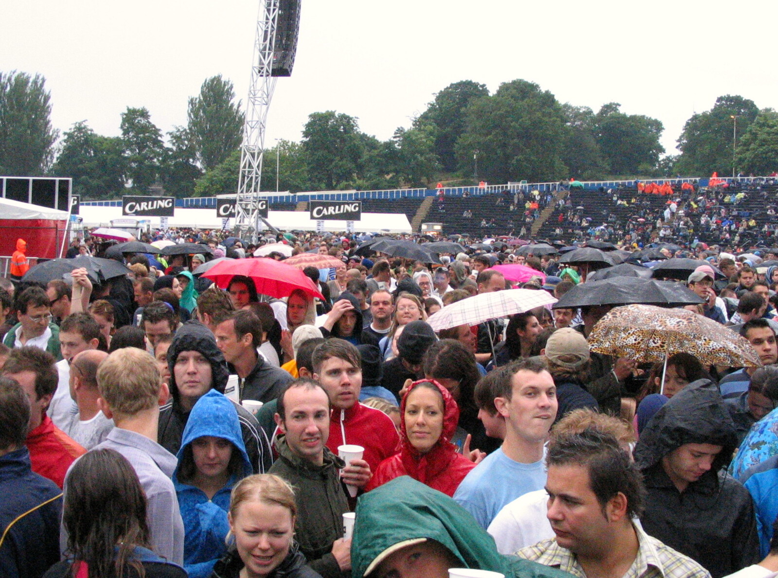The crowd deals with several deluges from Coldplay Live at Crystal Palace, Diss Publishing and Molluscs, Diss and London - 28th June 2005