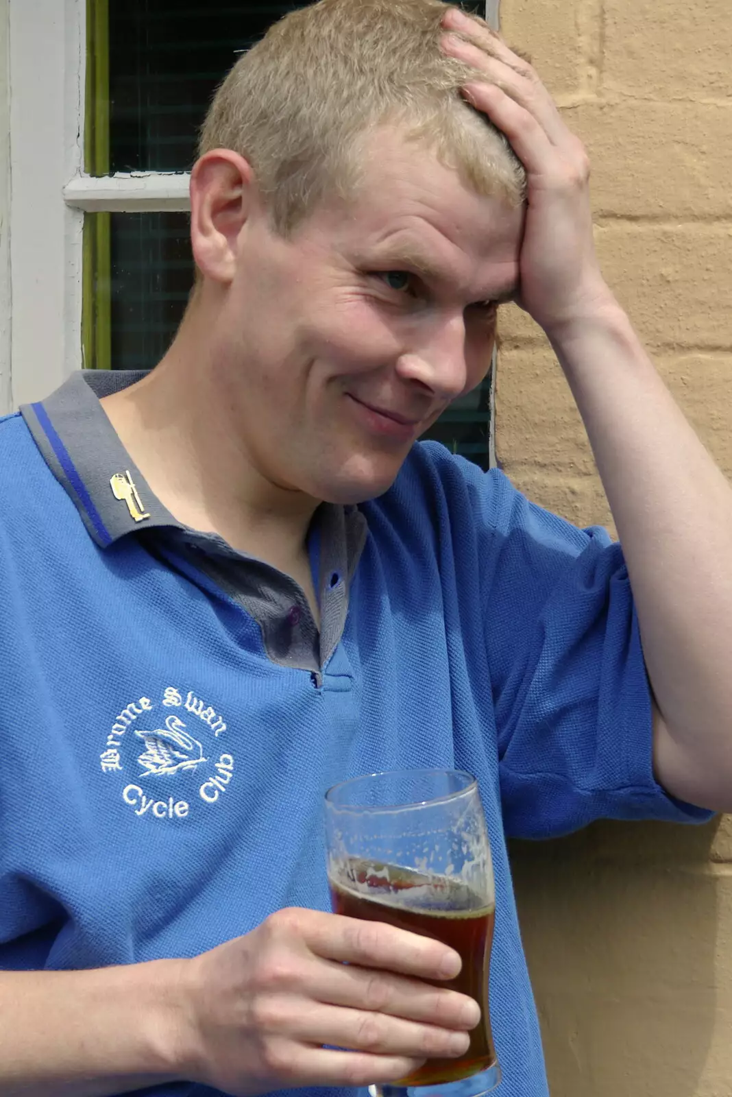 Bill bangs his head on a nearby hanging basket, from The BSCC Charity Bike Ride, Walberswick, Suffolk - 9th July 2005