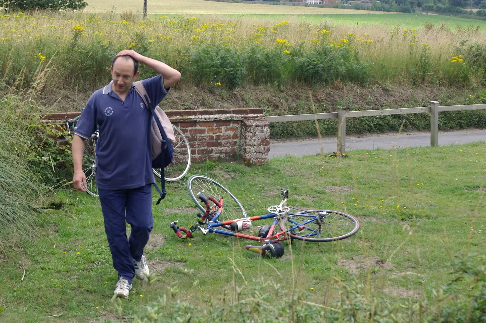 DH walks past Marc's abandoned bicycle, from The BSCC Charity Bike Ride, Walberswick, Suffolk - 9th July 2005