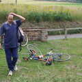 DH walks past Marc's abandoned bicycle, The BSCC Charity Bike Ride, Walberswick, Suffolk - 9th July 2005