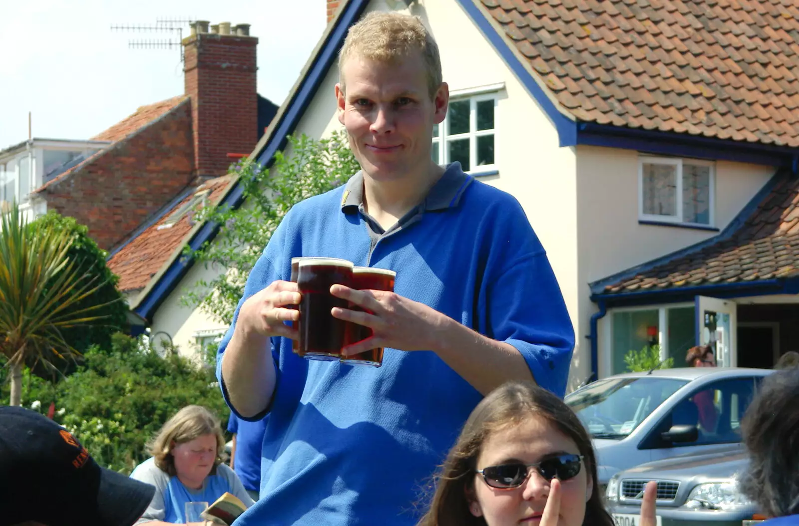 Bill brings some pints back from the bar, from The BSCC Charity Bike Ride, Walberswick, Suffolk - 9th July 2005