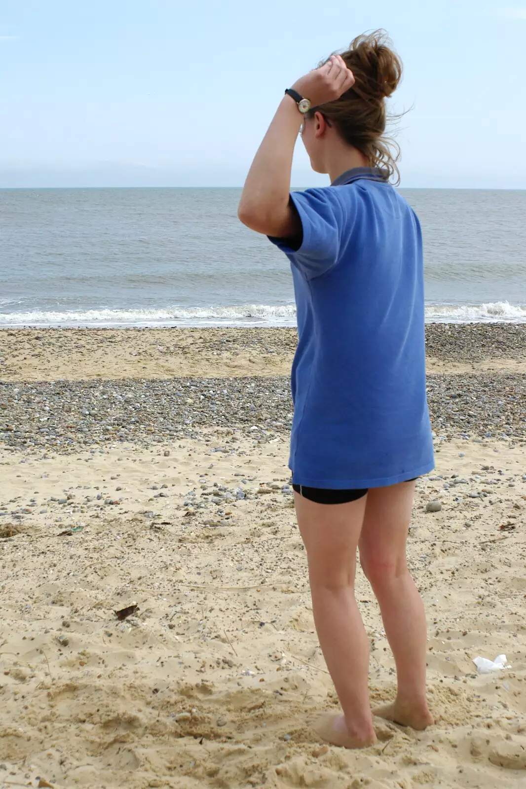 Suey lobs a small stone at the sea, from The BSCC Charity Bike Ride, Walberswick, Suffolk - 9th July 2005