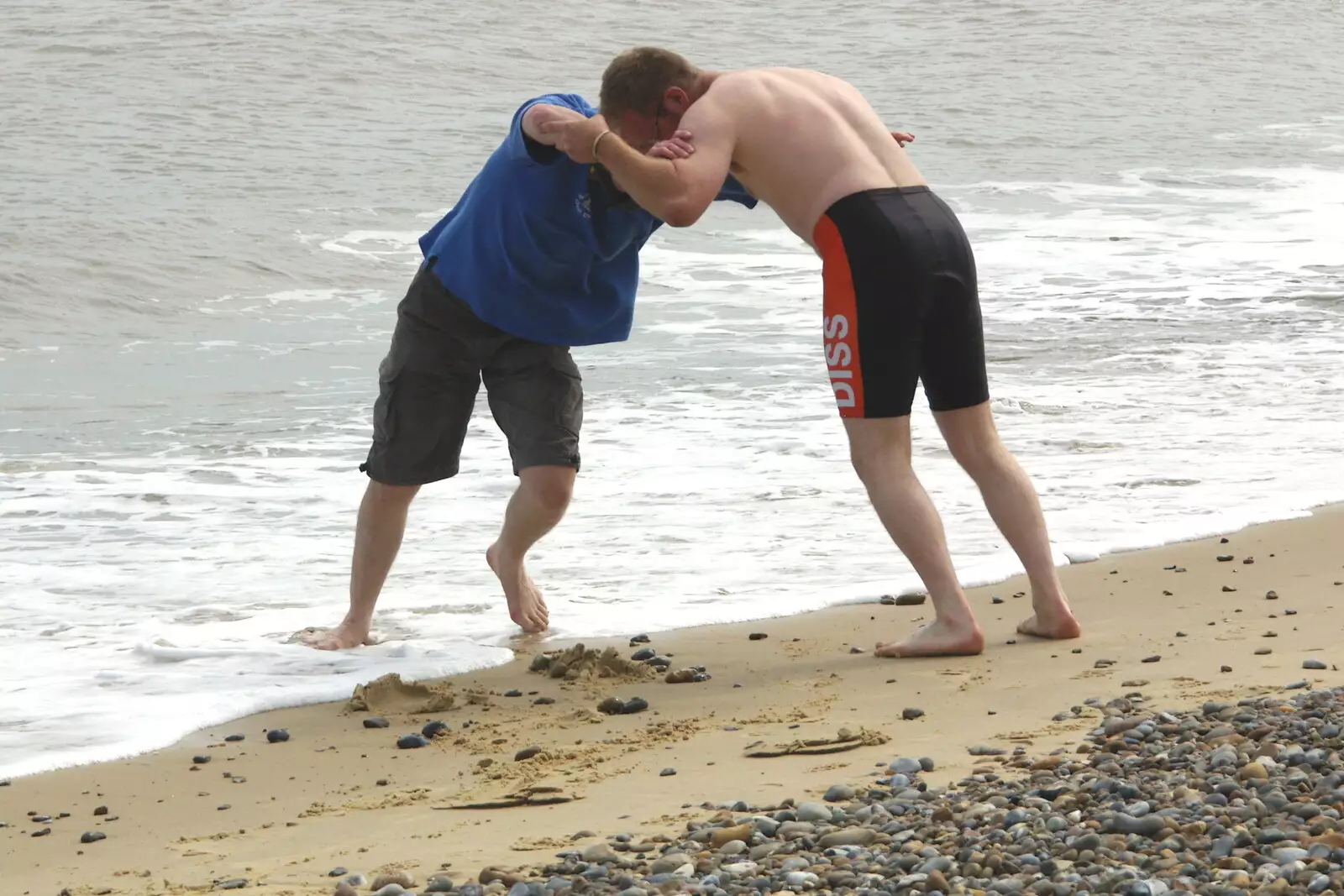 Marc and Bill have a wrestle, from The BSCC Charity Bike Ride, Walberswick, Suffolk - 9th July 2005