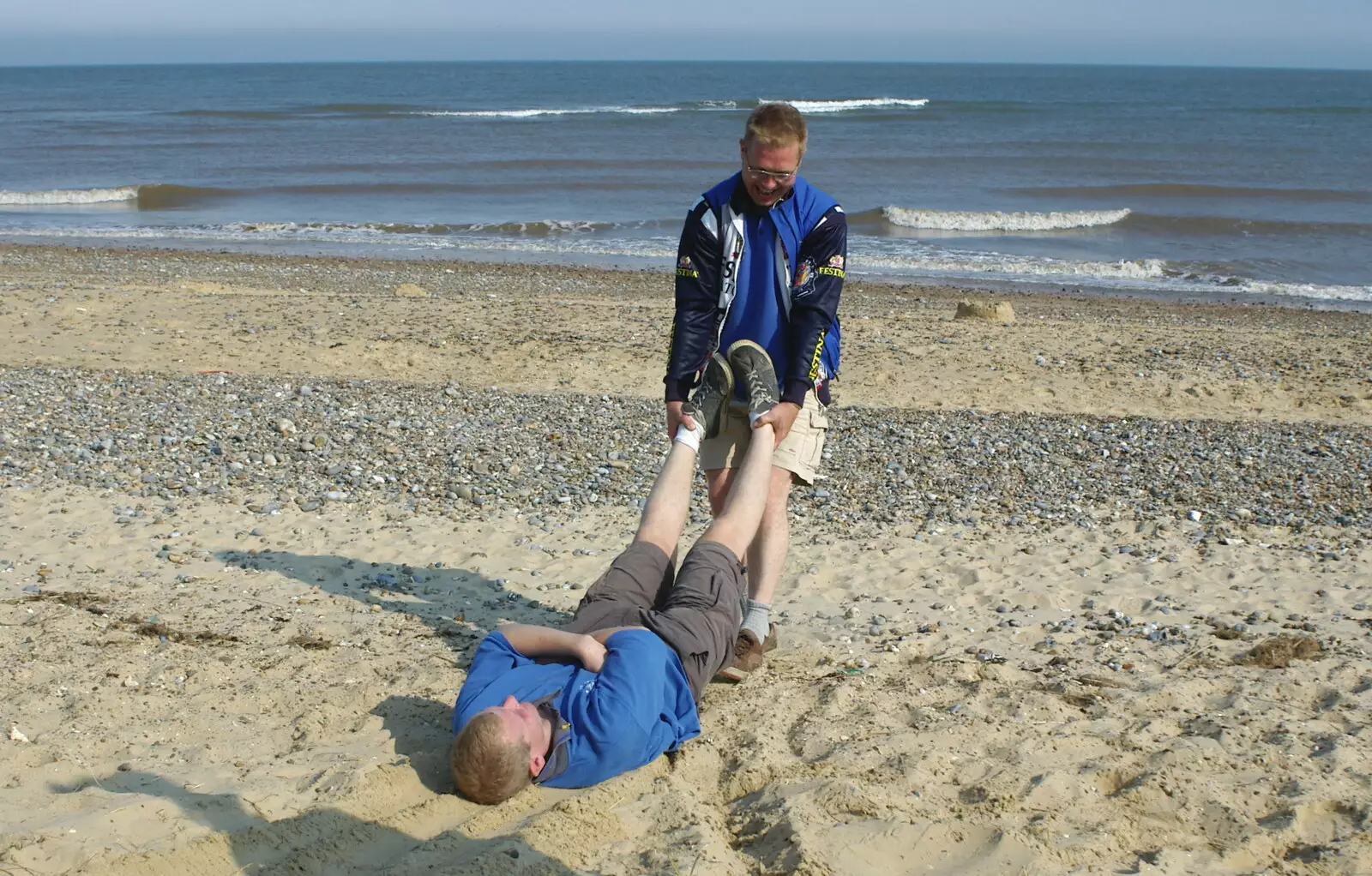 Marc drags Bill off to the sea, from The BSCC Charity Bike Ride, Walberswick, Suffolk - 9th July 2005