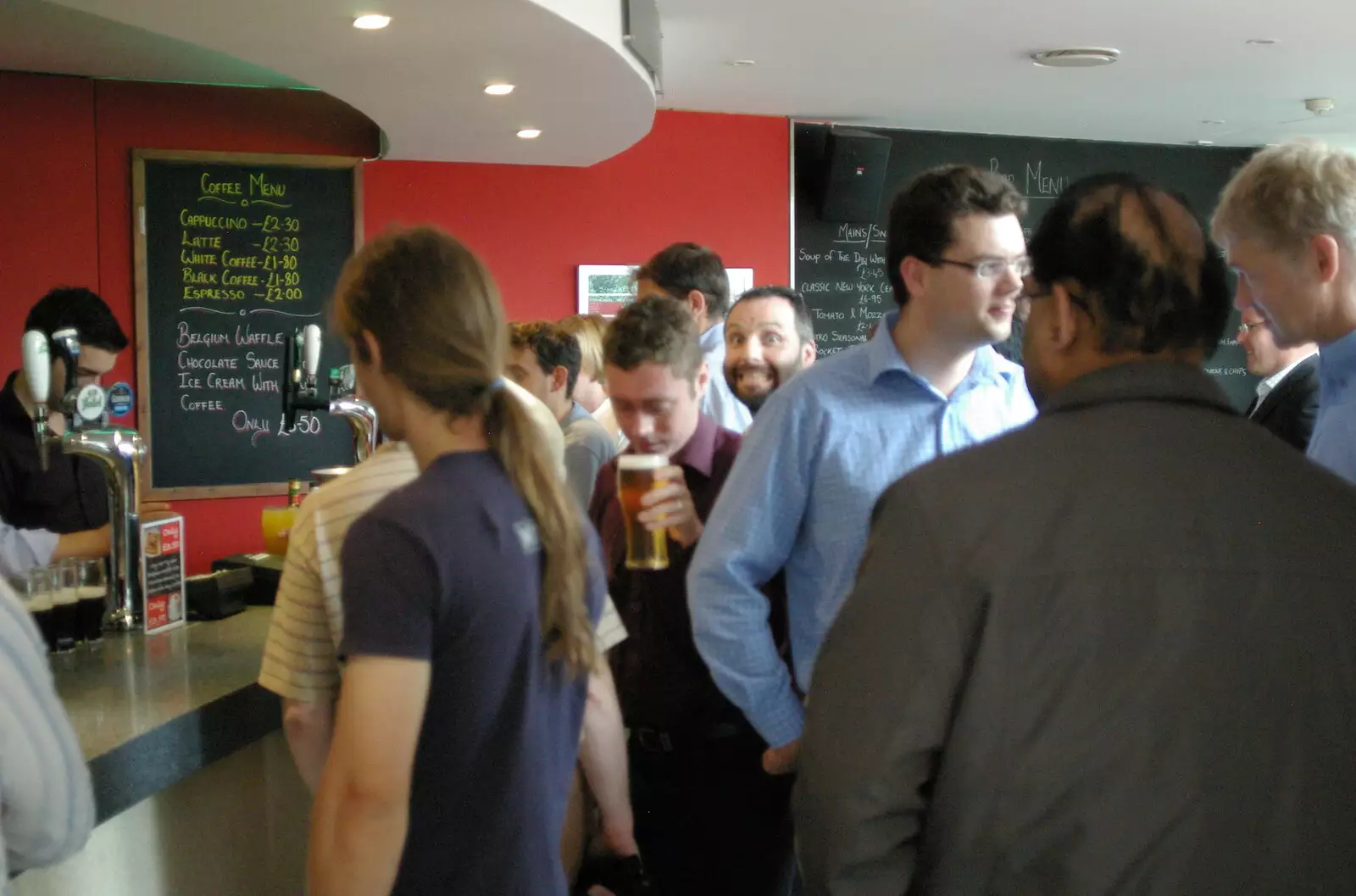 Craig grins from the other side of the bar, from Steve Ives' Leaving Lunch, Science Park, Cambridge - 11th July 2005