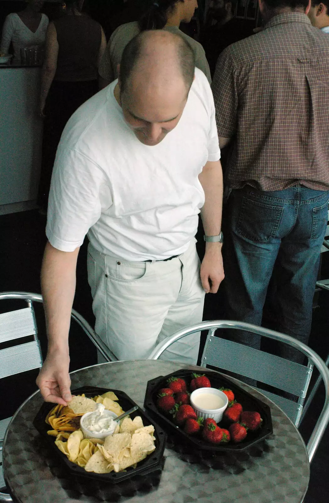 Francis looks at nachos, from Steve Ives' Leaving Lunch, Science Park, Cambridge - 11th July 2005