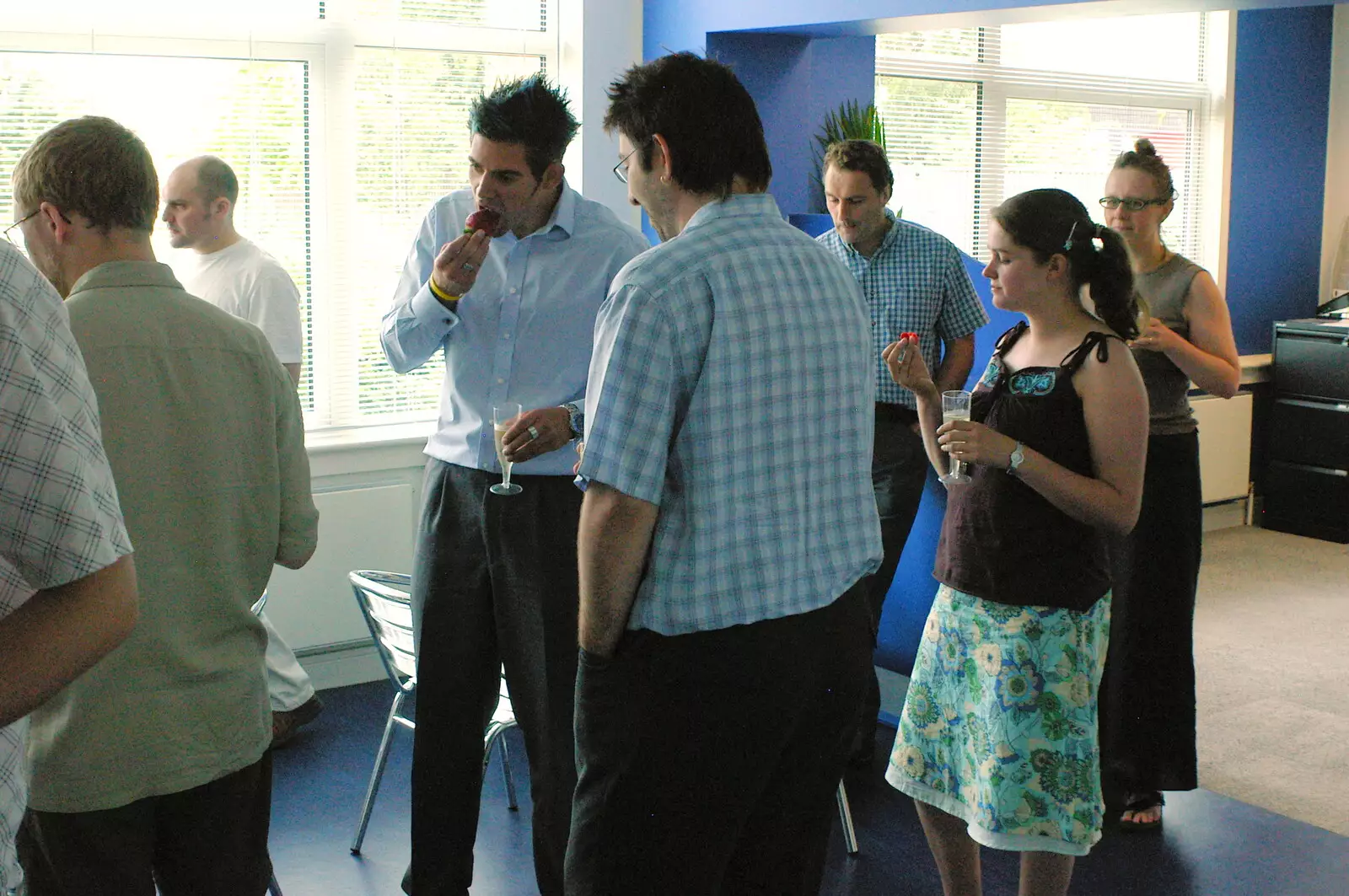 Isobel contemplates a strawberry, from Steve Ives' Leaving Lunch, Science Park, Cambridge - 11th July 2005