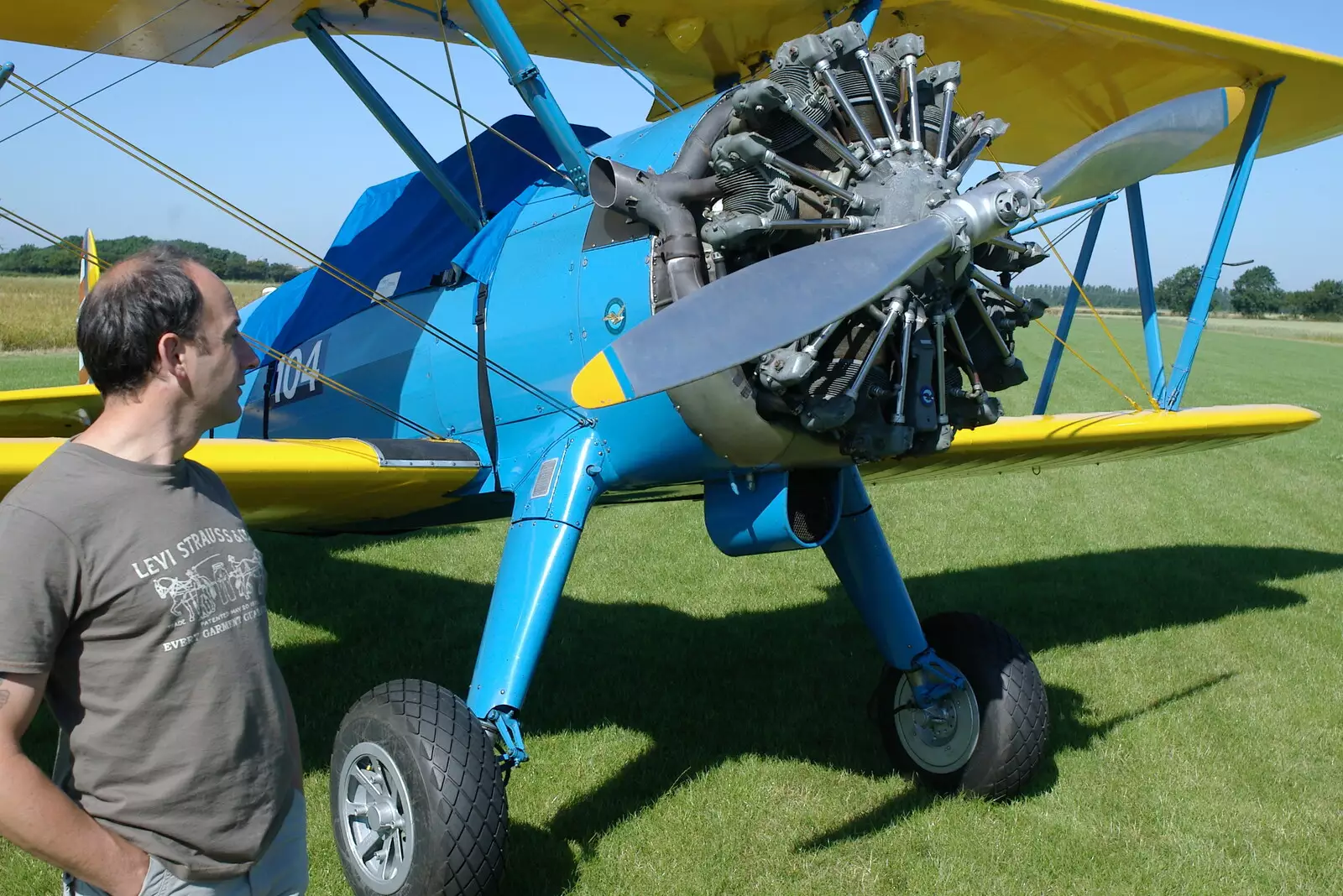 DH inspects the Stearman in the morning, from A Day With Janie the P-51D Mustang, Hardwick Airfield, Norfolk - 17th July 2005