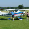 The Cessna is pushed out of the hangar, A Day With Janie the P-51D Mustang, Hardwick Airfield, Norfolk - 17th July 2005