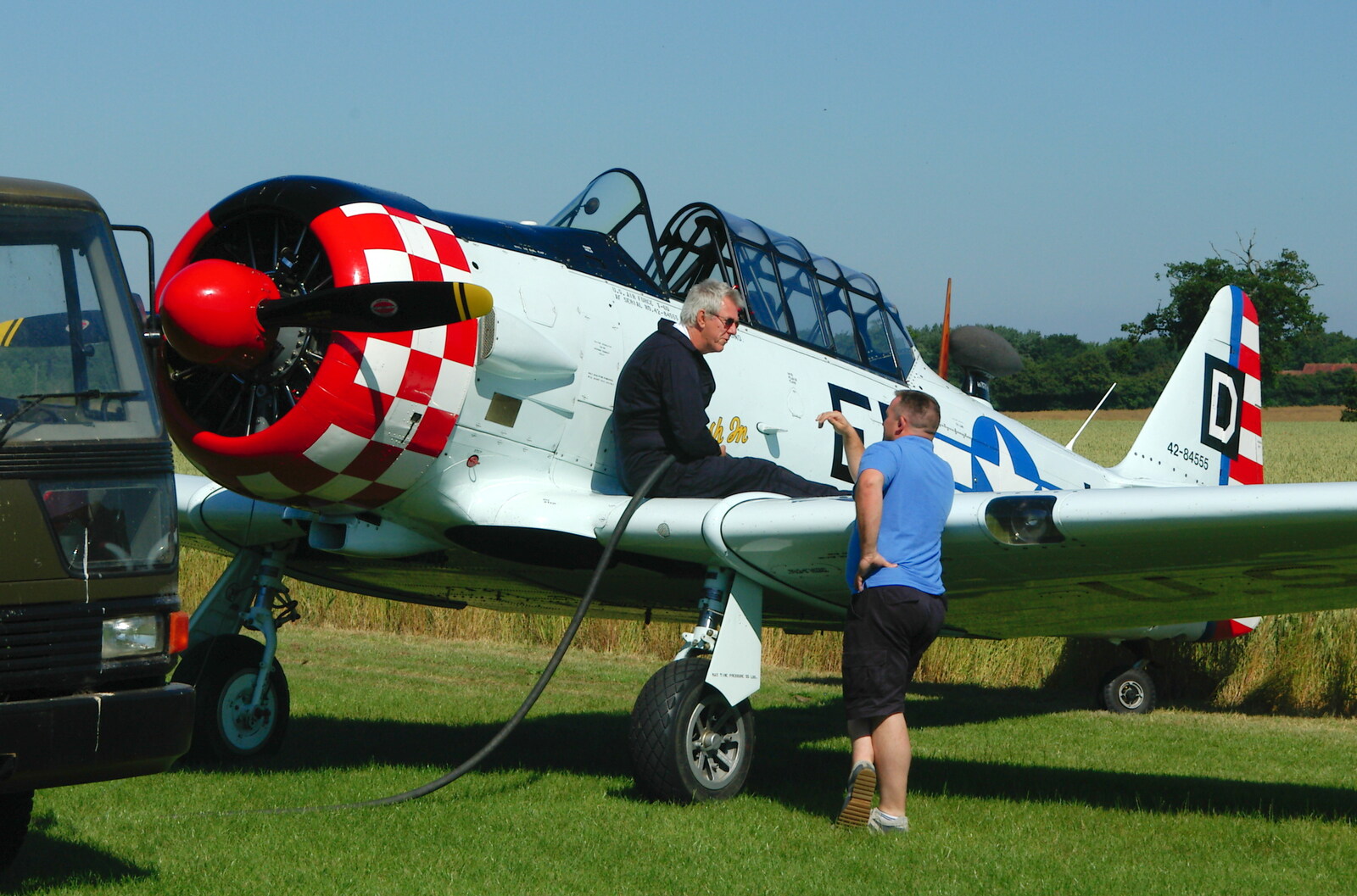 The Harvard is fueled up from A Day With Janie the P-51D Mustang, Hardwick Airfield, Norfolk - 17th July 2005