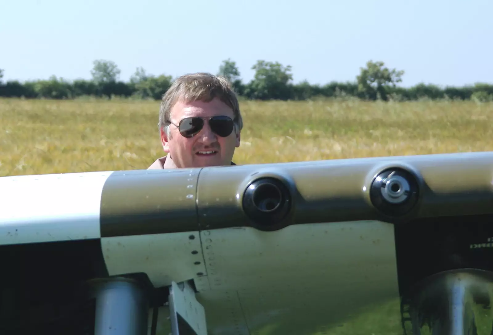 Maurice Hammond peers over the wing, from A Day With Janie the P-51D Mustang, Hardwick Airfield, Norfolk - 17th July 2005