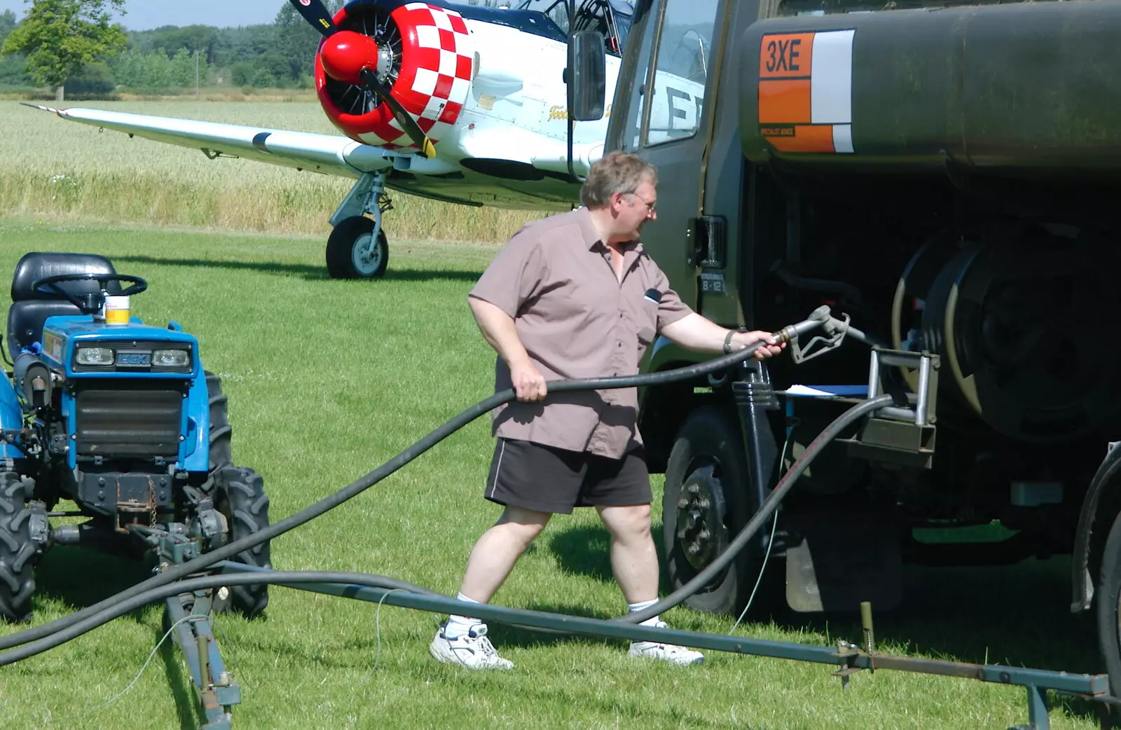 Maurice puts the pump back, from A Day With Janie the P-51D Mustang, Hardwick Airfield, Norfolk - 17th July 2005